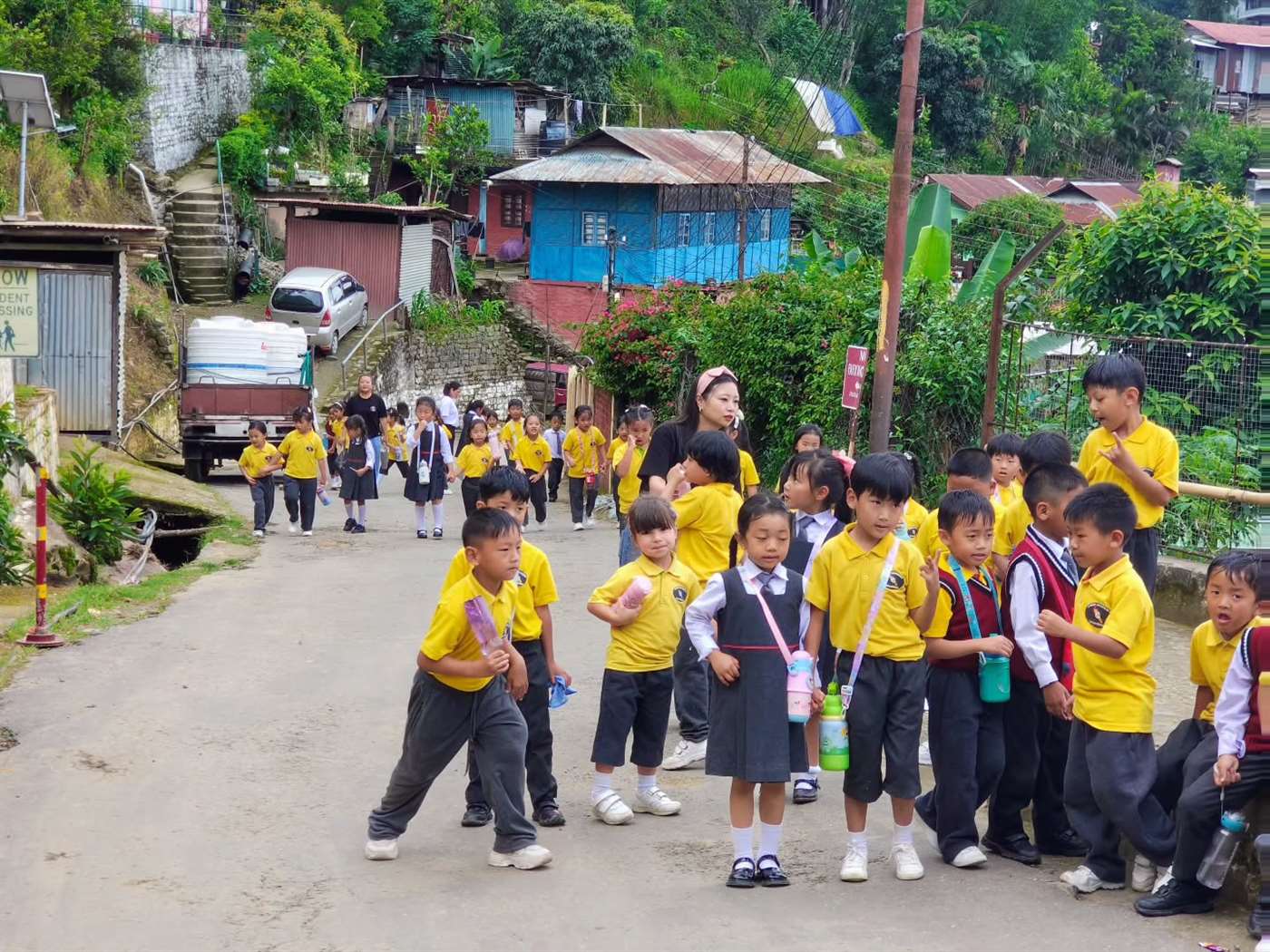 Eden Academy students walking through Kumlong ward, Mokokchung