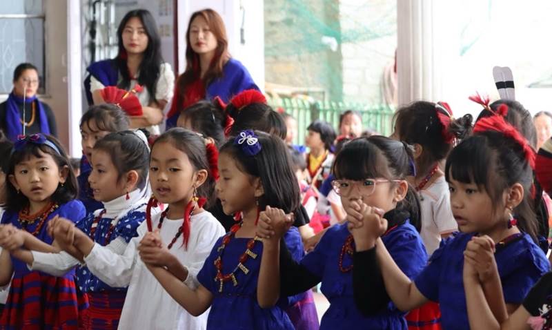 Students in traditional Naga dress for a cultural programme